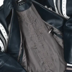 A navy varsity jacket featuring the Pelle Pelle Soda Club Leather Jacket with encrusted plush detailing and premium craftsmanship.